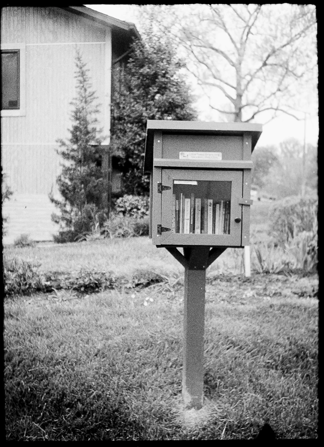 little library shot on Ilford HP5 Plus 400 with a Fujica Half, by mollylovesphotography