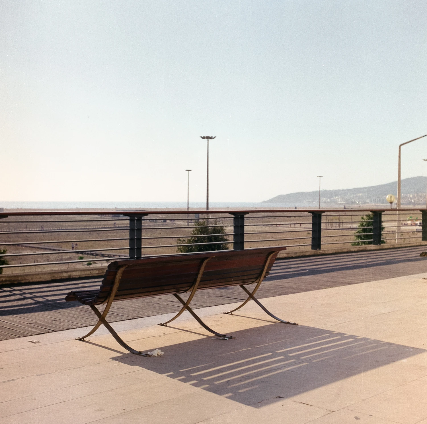it's something about benches and shadows shot on Kodak Ektar 100 with a Yashicaflex Model A, by Simão Carreira