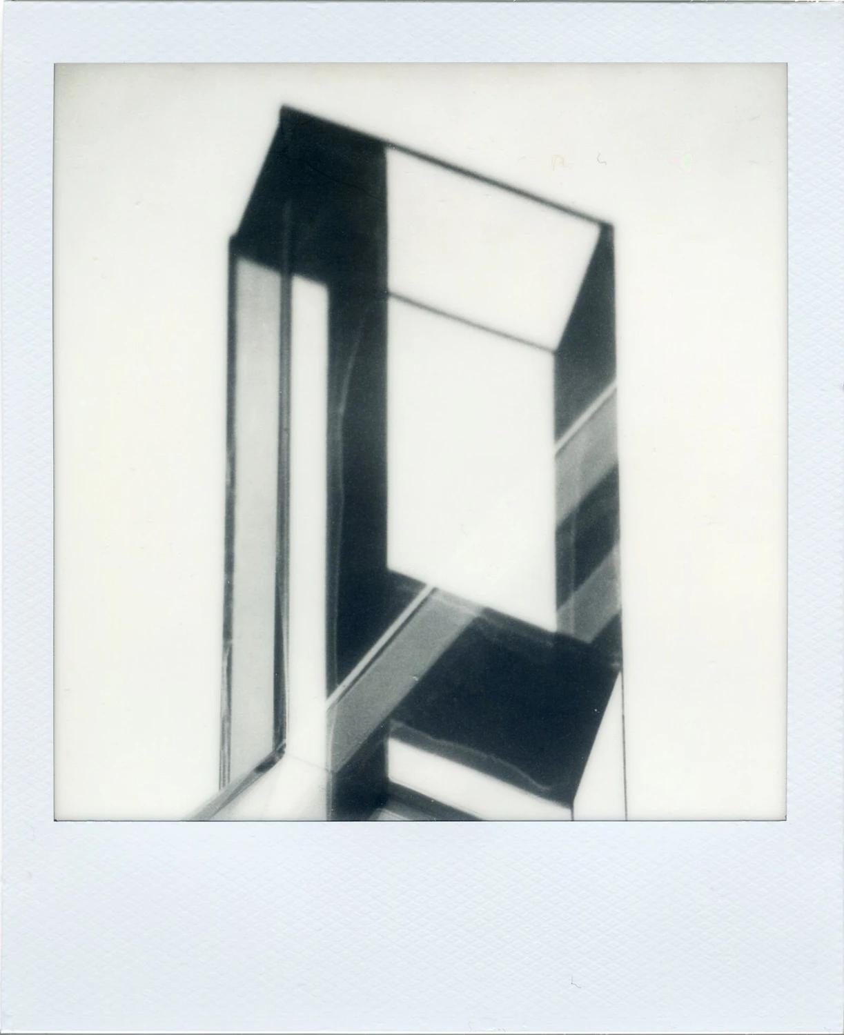 Refractions on a reflection shot on Polaroid B&W 600 with a Polaroid SX-70 Alpha 1, developed at Instant Film, by MelvynJ