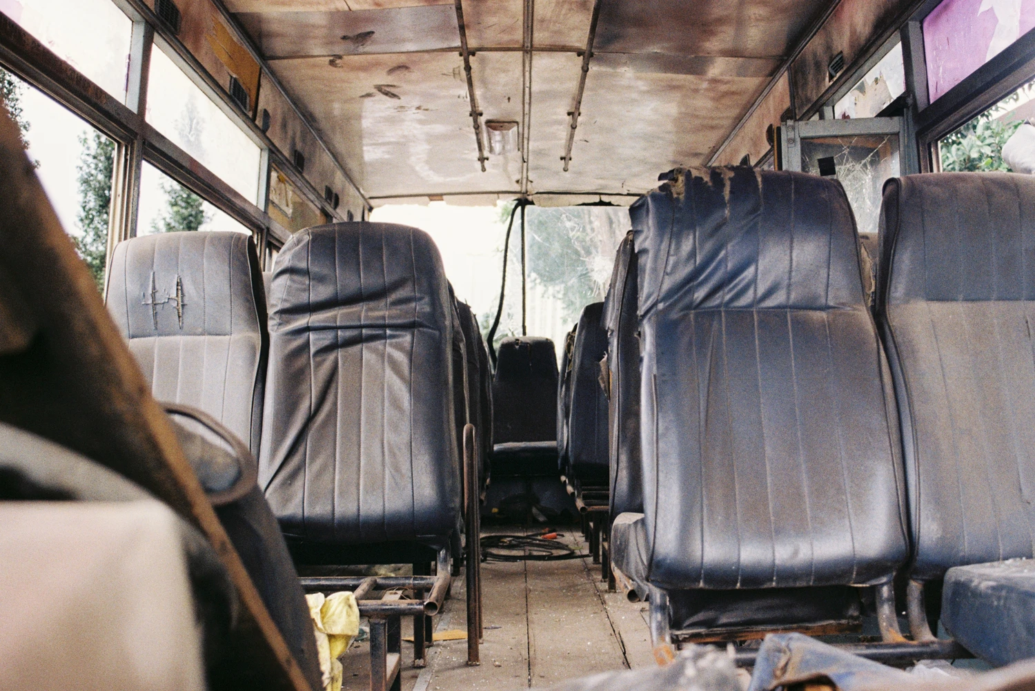 Abandoned school bus shot on Kodak Gold 200 with a Canon EOS Kiss III L, by Ahmad Haziq