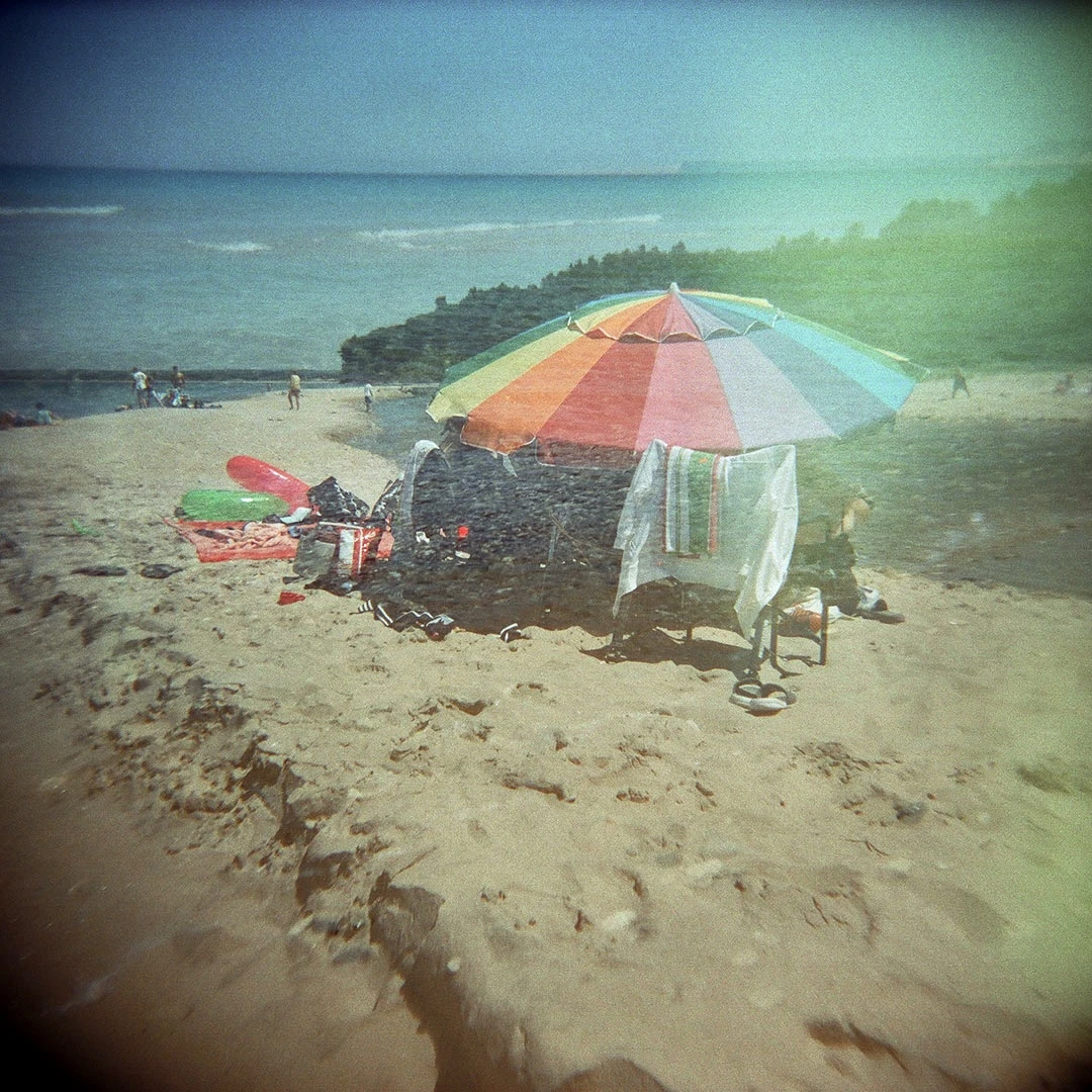 Rainbow Umbrella shot on Cinestill 800T with a Holga 120S, by Katie Mollon