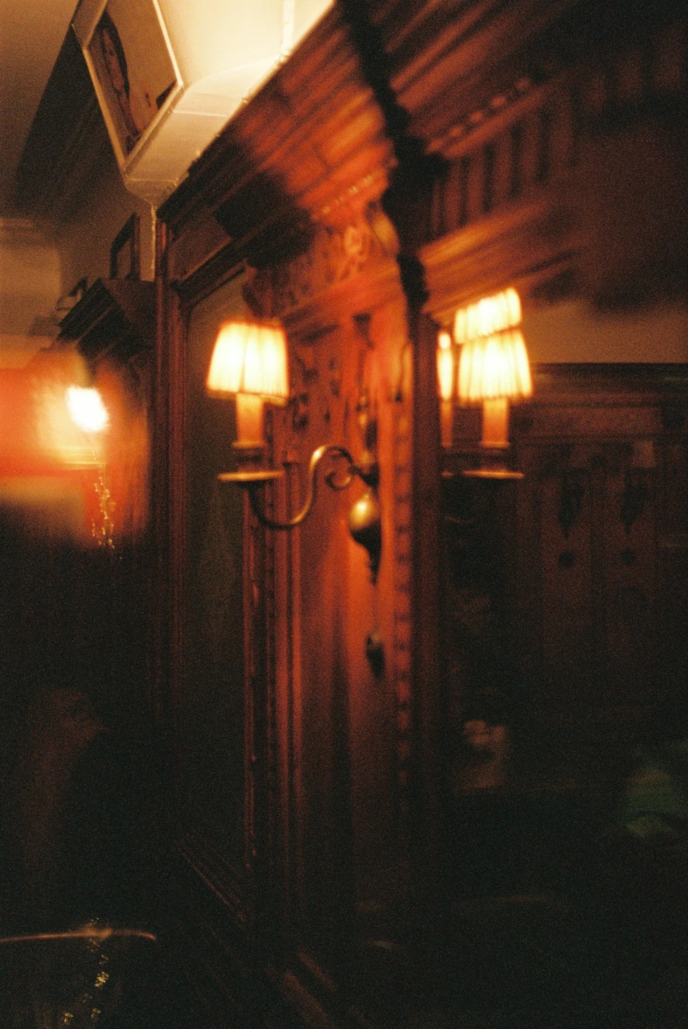 Moody light in a little restaurant shot on Kodak Portra 400 with a Canon FTb, by Silvano Falivena