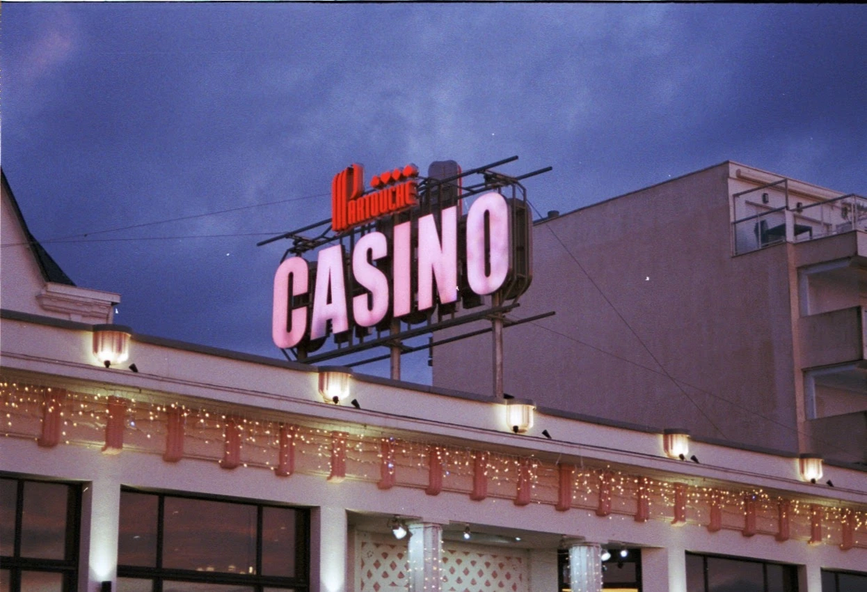 Blue hour and neon shot on Kodak Gold 200 with a Minolta Dynax 404si, developed at Nation Photo, by Claire
