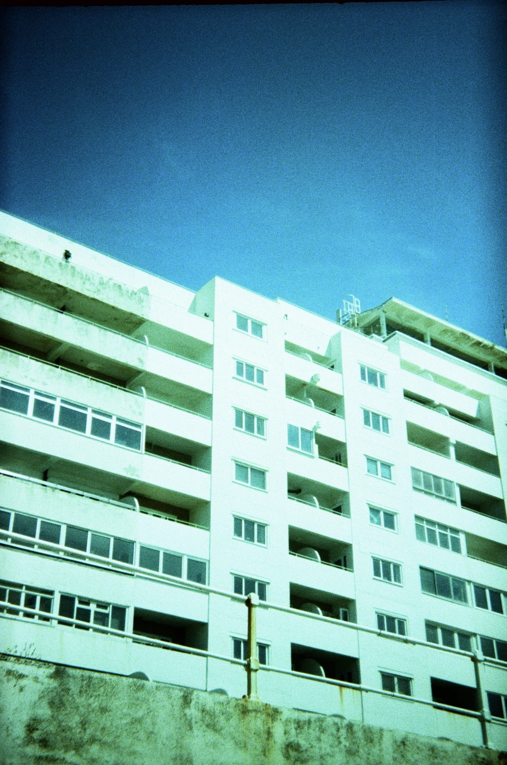 Marine Court, St Leonards on Sea shot on Lomography XPro Chrome 100 with a Holga 135, developed at Take It Easy, by Jon