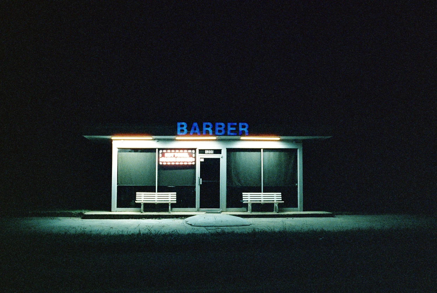 Roadside Barbershop at 3am shot on Cinestill 800T with a Leica MP, developed at The Photo Spot, by Richard Vialet, ASC