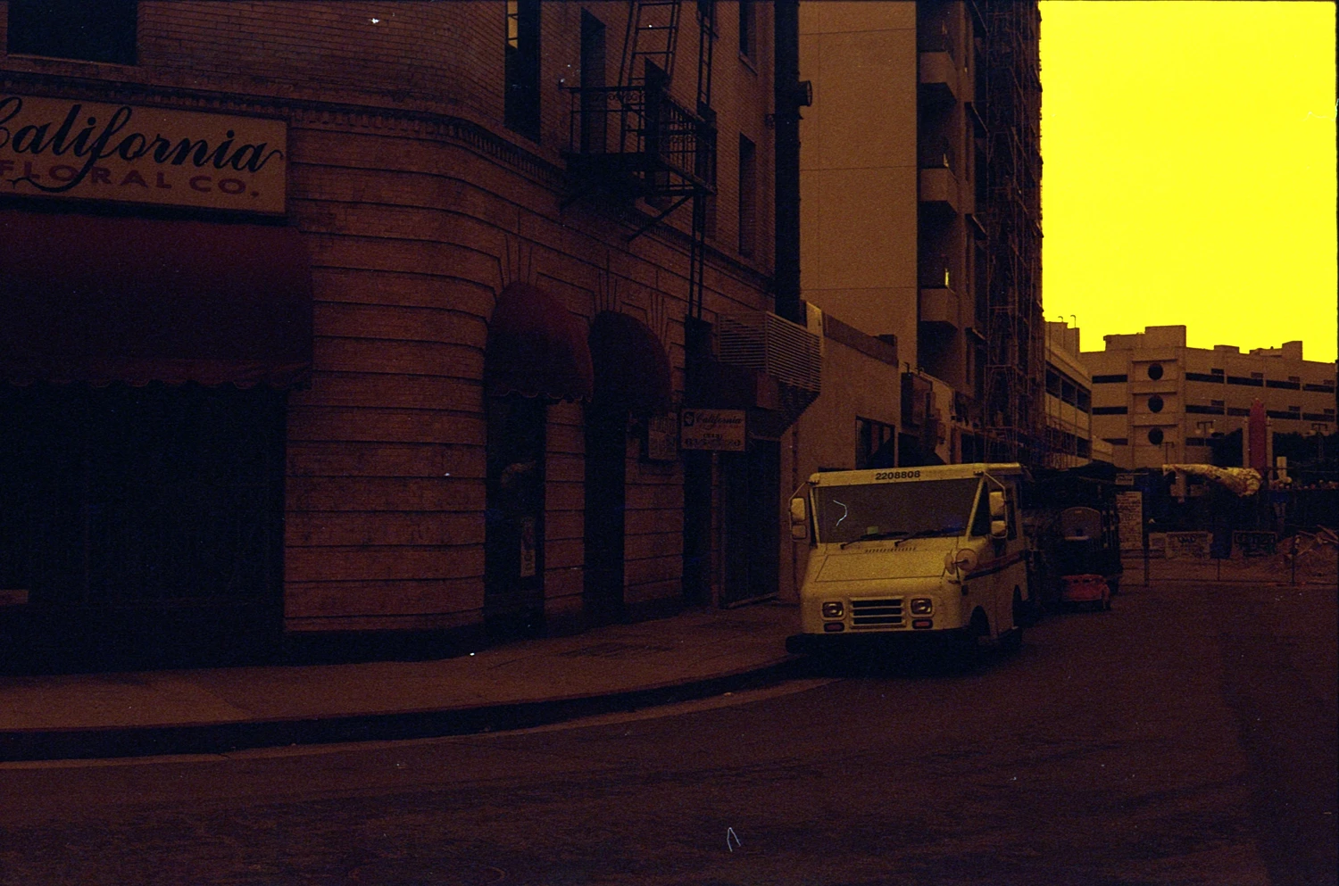 LA corner shot on Lomography Redscale XR 50-200 with a Canon Elan IIe, developed at Pro Photo Factory, by Aki Wandering