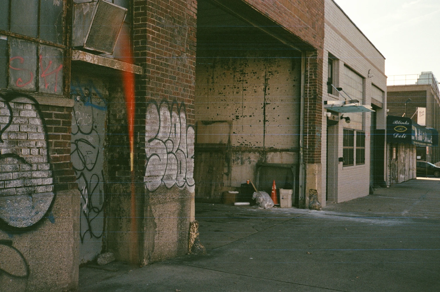 Garage shot on Fujifilm Superia X-TRA 400 with a Minolta Hi-Matic G, by Ray