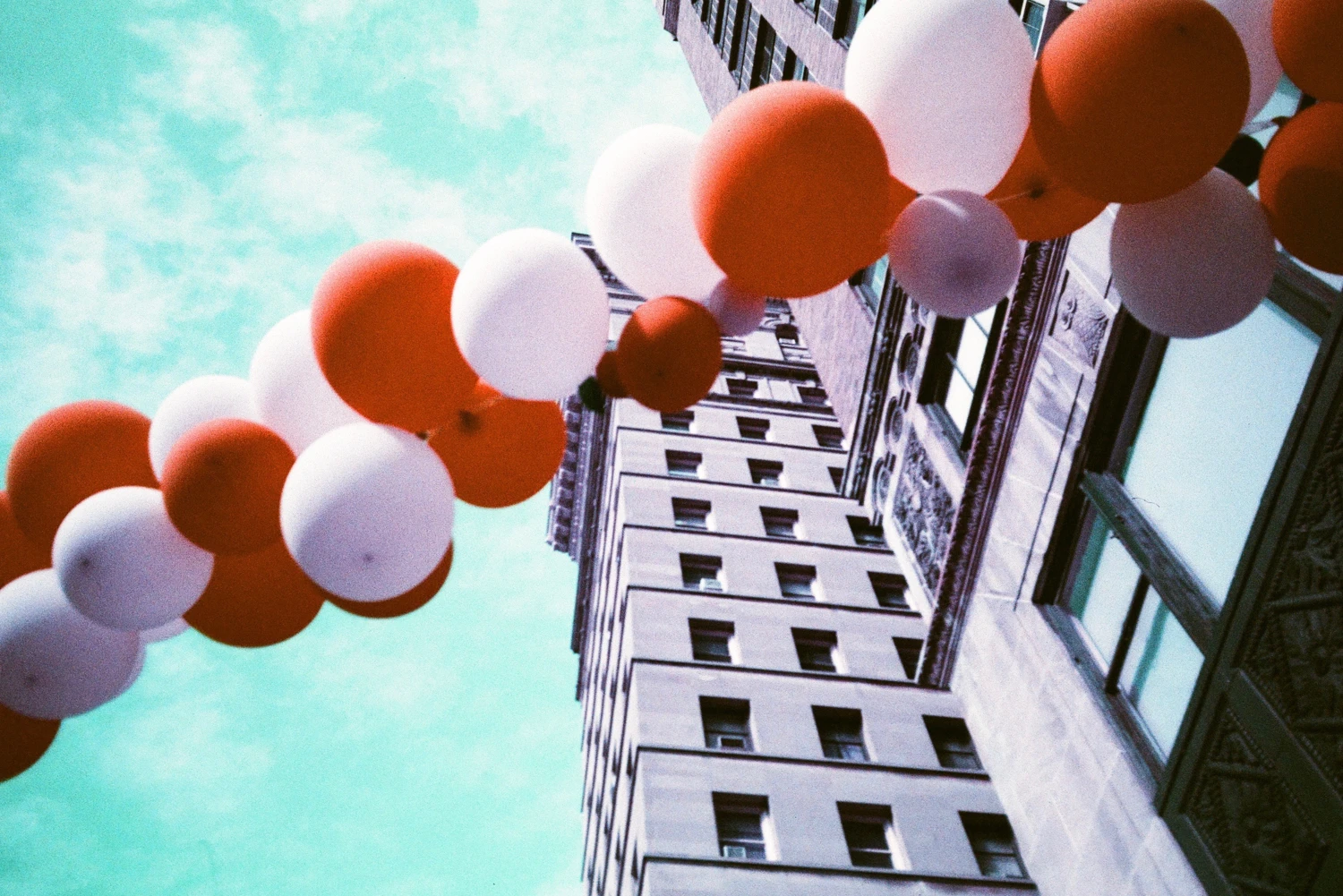 Broadway Balloons shot on Lomography LomoChrome Purple 100 with a Yashica T4 Super, by Anniebee