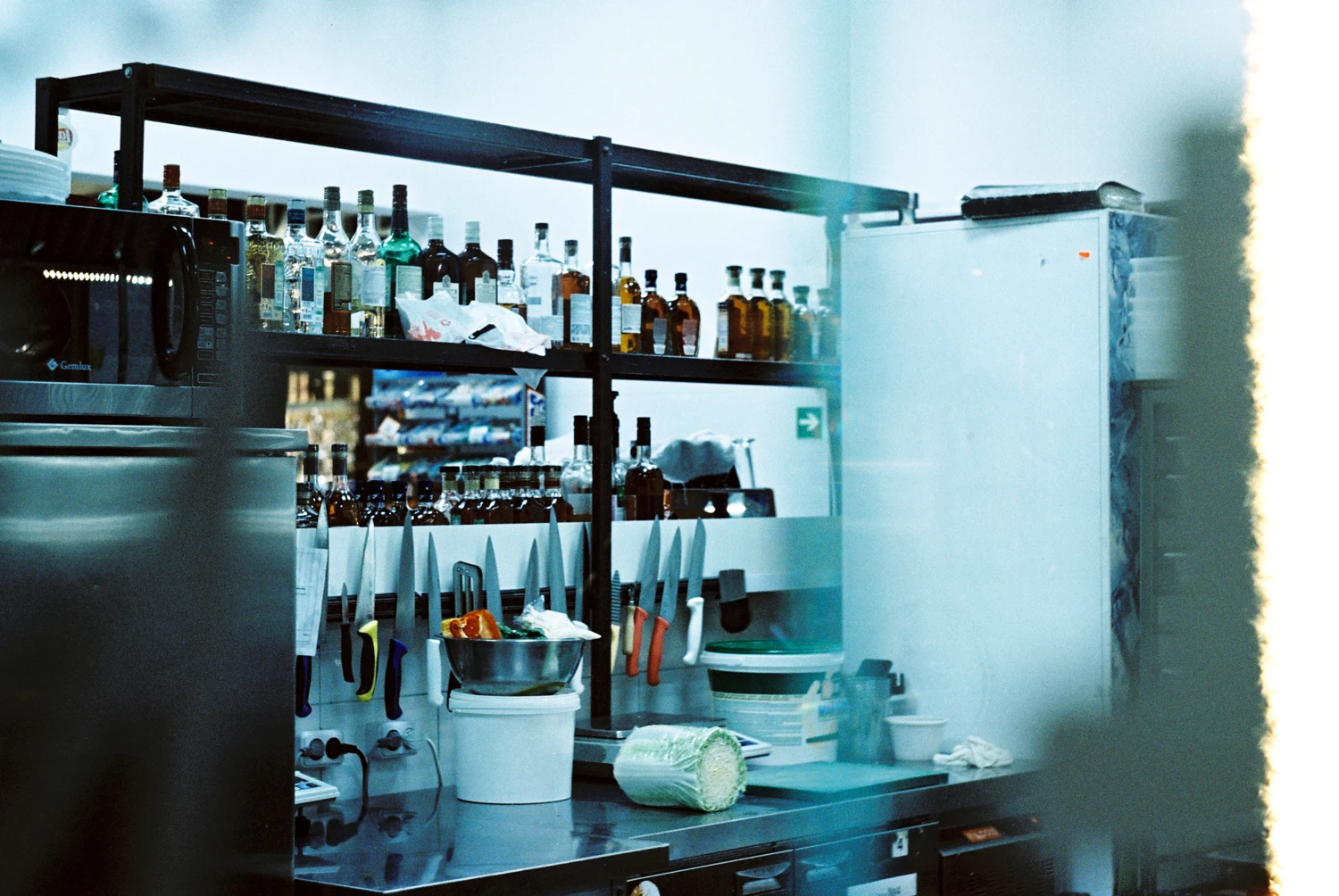 Cold light at cafeteria's kitchen shot on Kodak Vision 3 250D with a Zenit 21XS, by sosha