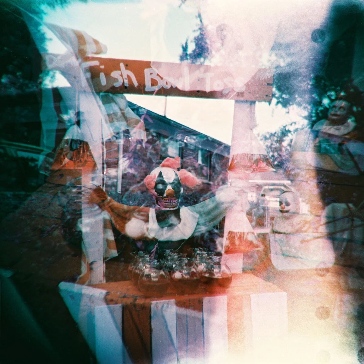 Carnival Clowns shot on Lomography LomoChrome Purple 100 with a Holga 120S, by Katie Mollon