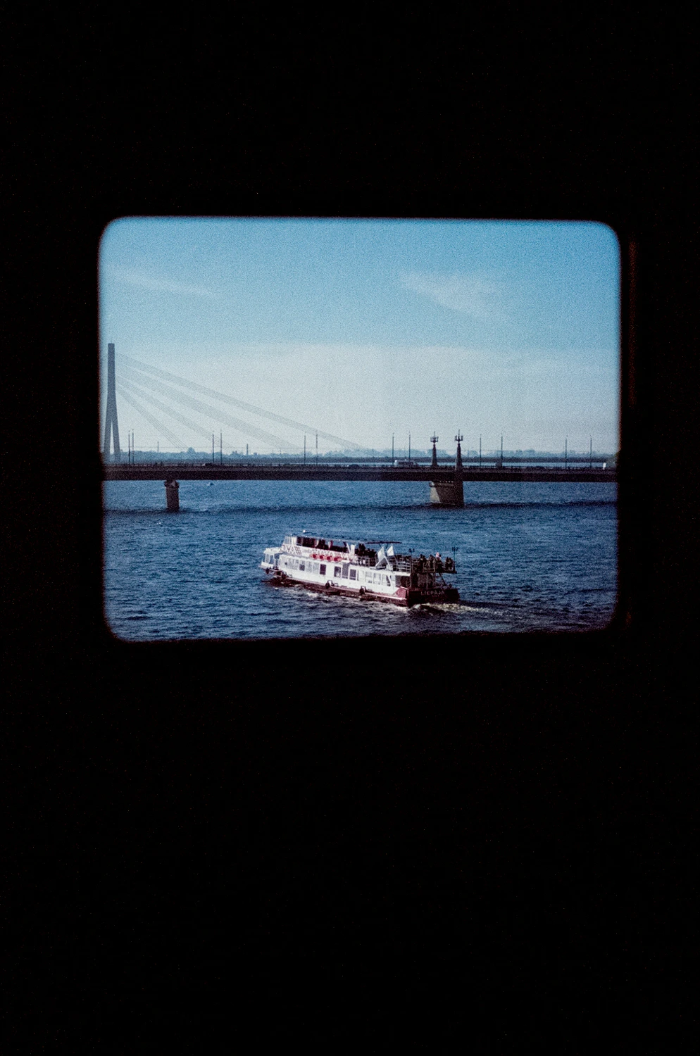 Through the window of a train shot on Fujifilm FujiColor C200 with a Pentax SF-7, by Lauris Matulis