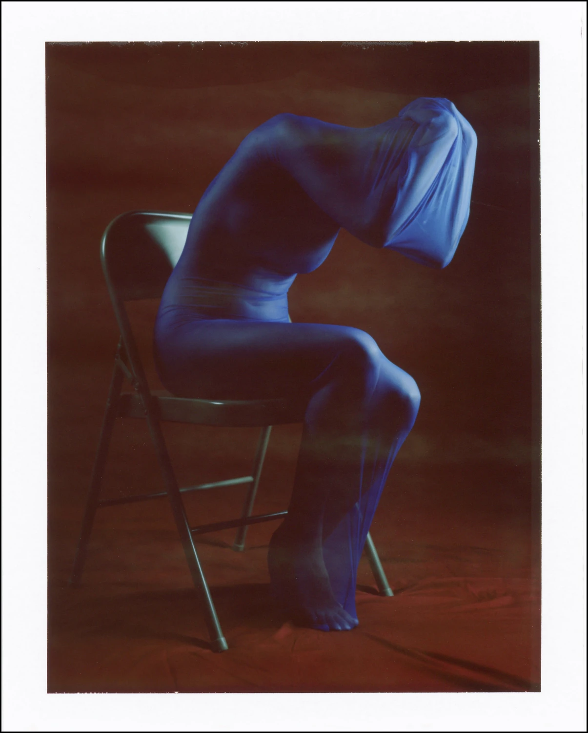 Blue Bodysock shot on Polaroid 600 with a Polaroid Land Camera 195, by Scott Rust