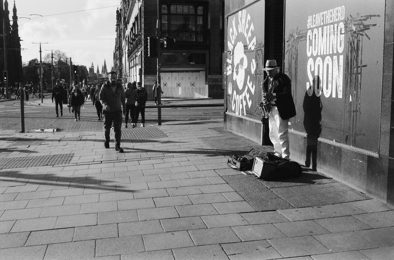 Street Musician in Edinburgh shot on Ilford Delta 400 with a Rollei 35TE, developed at Soup N Film, by Haryanto