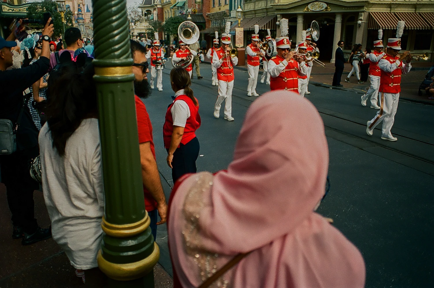 Watching The Parade shot on Kodak Portra 400 with a Minolta X-370N, developed at The DarkRoom, by David Stanick
