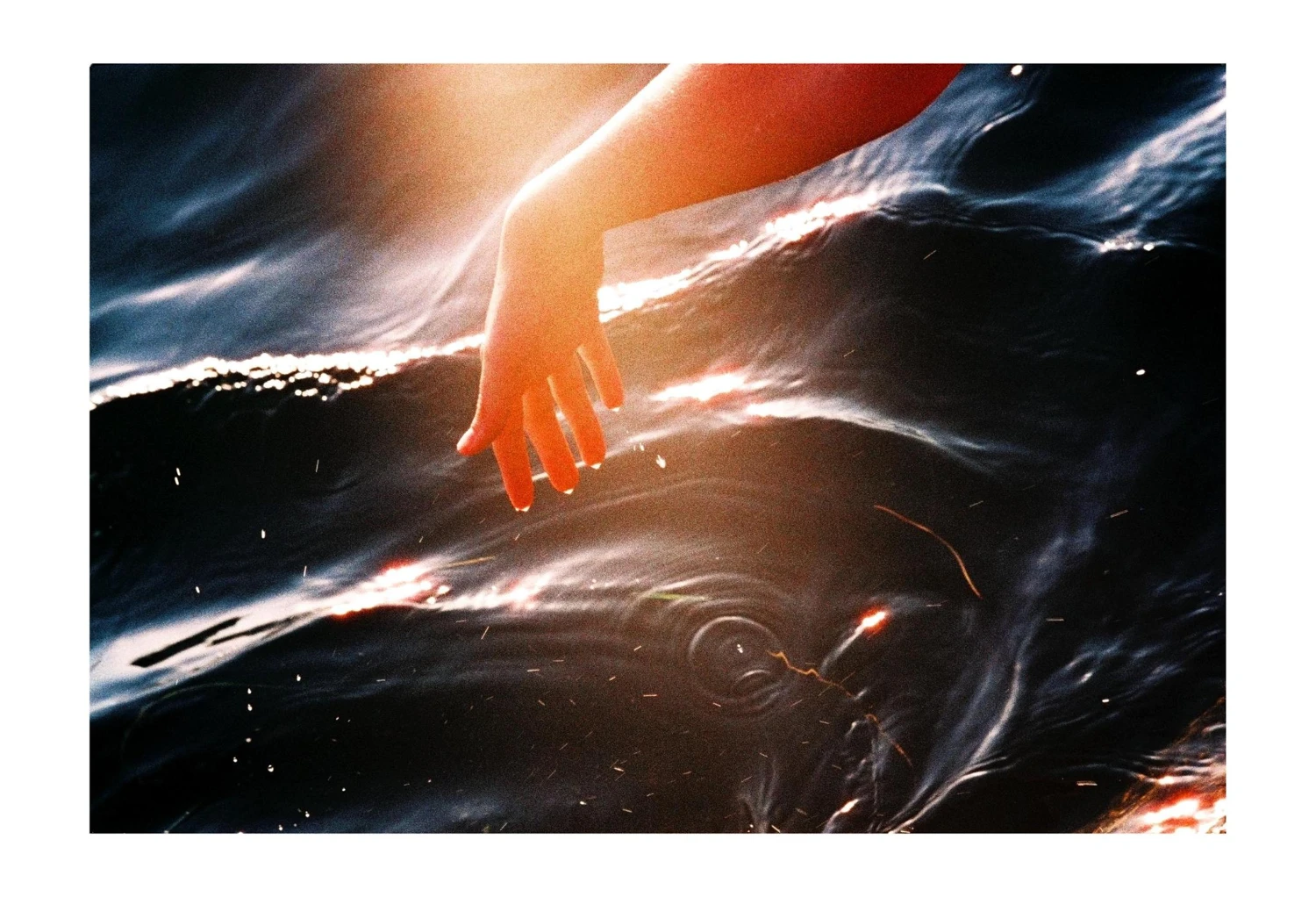 Touching the Sea. shot on Adox Color Mission 200 with a Leica M3, by Philipp A. Grzywaczyk
