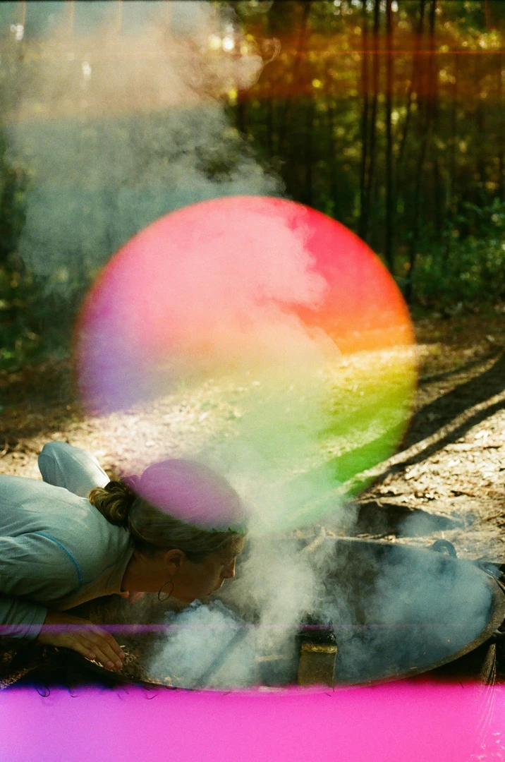 Stoking the Fire shot on Psychedelic Blues 400 #6 with a Canon Rebel 2000, by Katie Mollon