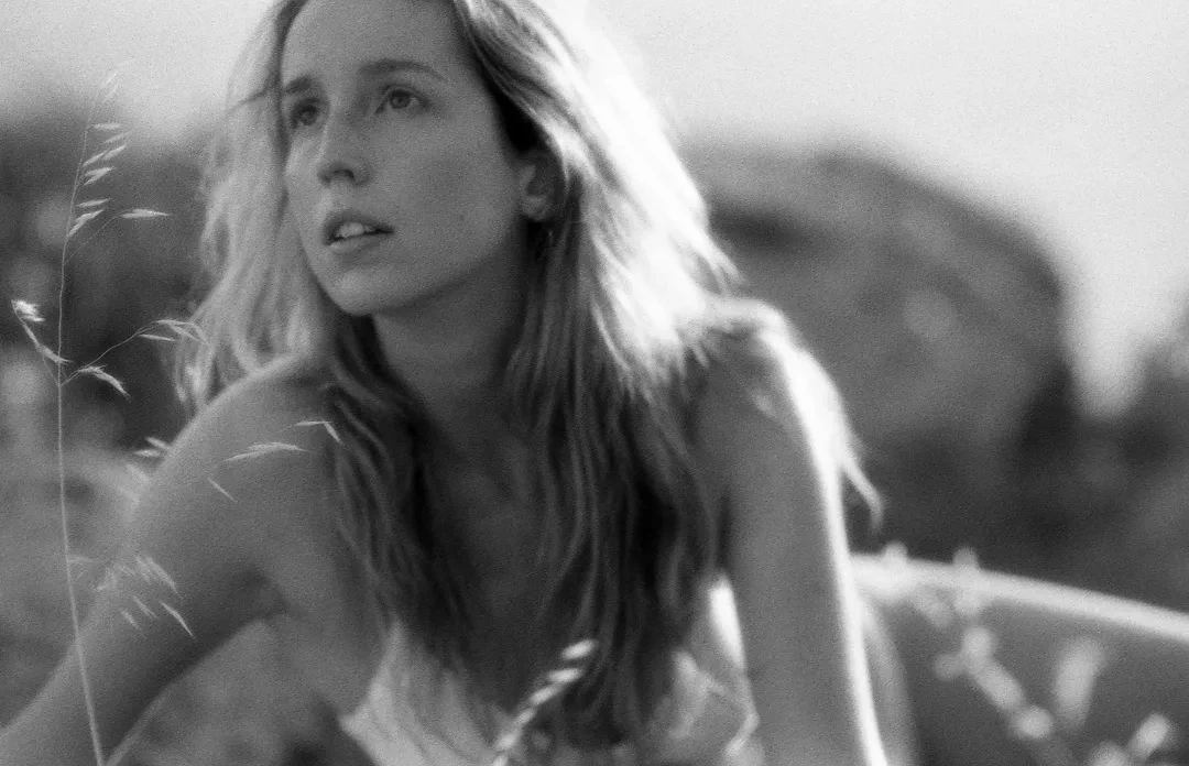 Self-portrait shot on Ilford Delta 400 with a Canon AE-1, developed at Malvarrosa Film Lab, by Clarissa Sofía