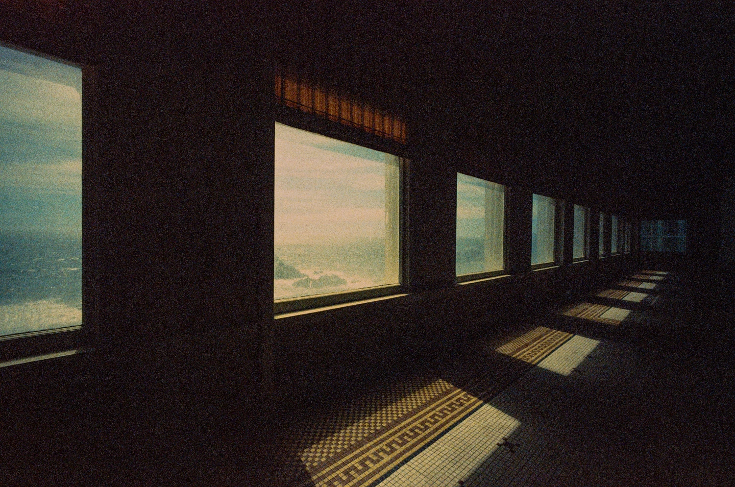 Light spills into an abandoned diner shot on Film Photography Project Retrochrome 400 with a Konica Hexar RF, by filmhowyalike